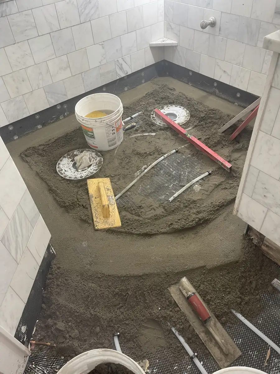 Mortar bed floated over wire lath with radiant tubing inside it