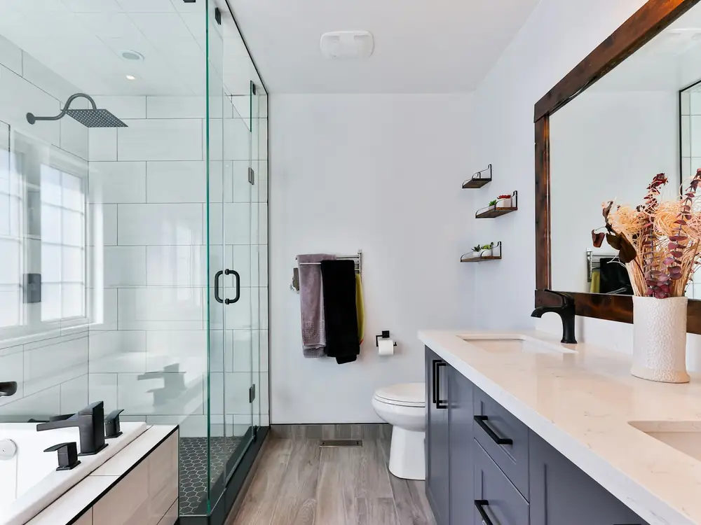 Glass-enclosed tile shower in a finished bathroom