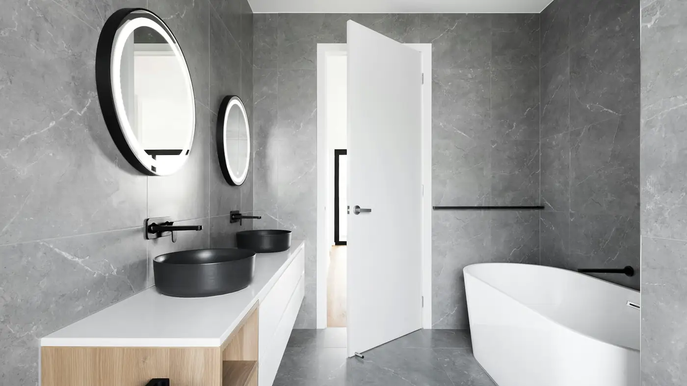 Large-format stone tile bathroom in a modern home